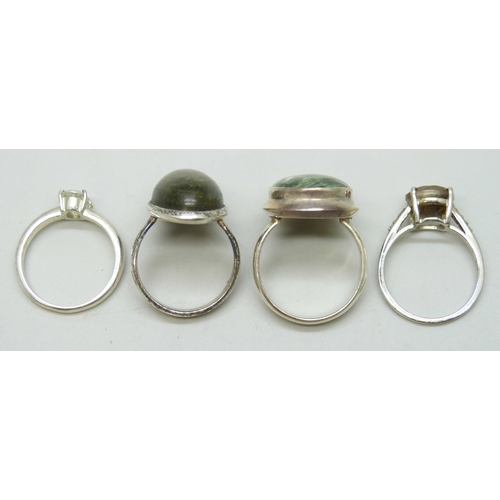 7155 - Four silver rings including TGGC examples, 24g