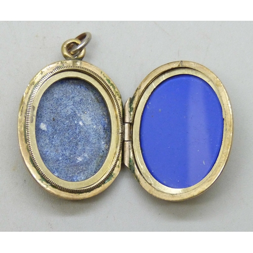 7166 - A yellow metal back and front hand painted enamel locket with Masonic symbol verso, 6.7g, 3cm includ... 