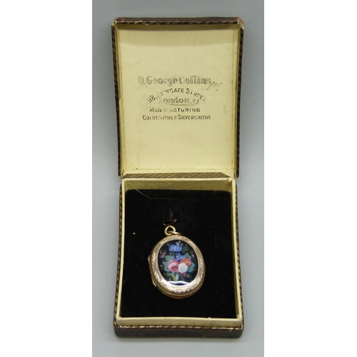 7166 - A yellow metal back and front hand painted enamel locket with Masonic symbol verso, 6.7g, 3cm includ... 