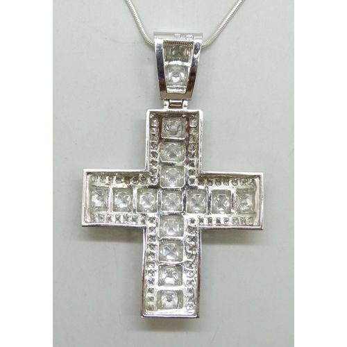 7170 - A large silver stone set cross pendant, on a silver chain, 83g total, 10cm including bail