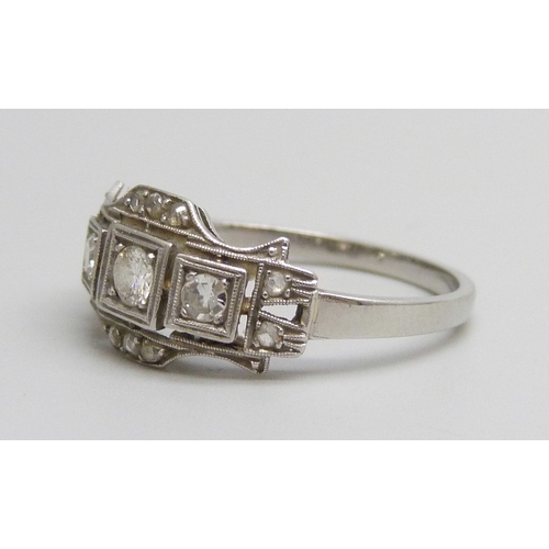 7134 - An Art Deco white metal diamond set ring, 3g, N