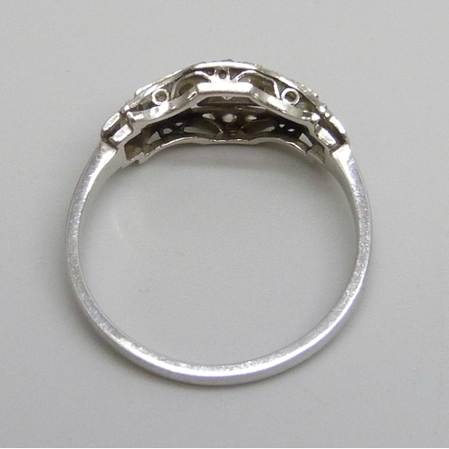 7134 - An Art Deco white metal diamond set ring, 3g, N