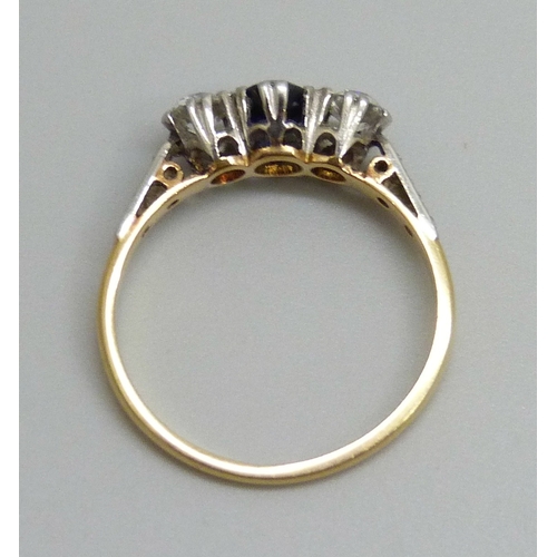 7137 - An 18ct gold and platinum set sapphire and diamond ring, 2.4g, M