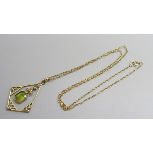 7143 - A yellow metal, seed pearl and peridot pendant, 3.4cm including bail, on a 9ct gold chain, 2.3g tota... 
