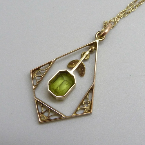 7143 - A yellow metal, seed pearl and peridot pendant, 3.4cm including bail, on a 9ct gold chain, 2.3g tota... 