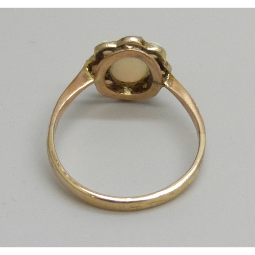 7144 - An early 20th century yellow metal opal cluster ring, some replacement unmatched stones, 1.5g, L