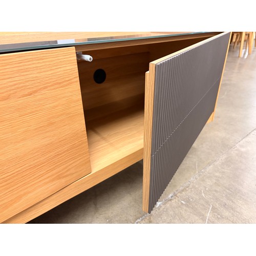 3001 - A Hobang oak large Television unit with glass top