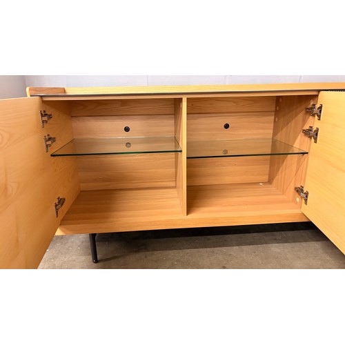 3002 - A Hobang oak 3 door sideboard with glass top