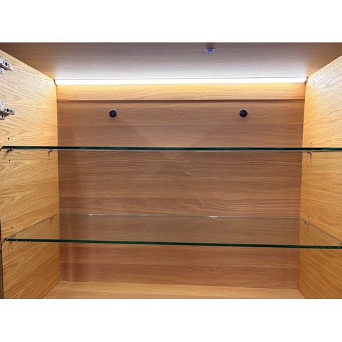 3005 - A Hobang oak 2 door illuminated display cabinet with glass top