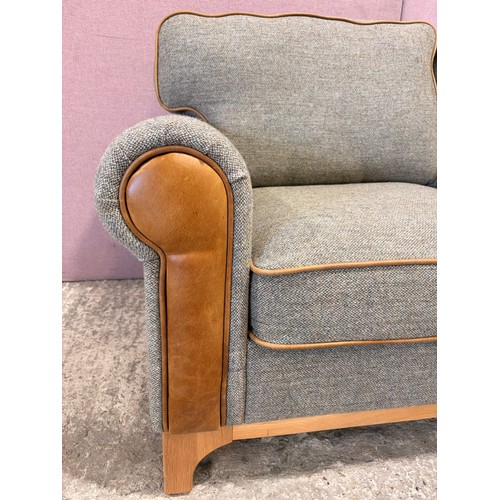 3008 - A Whitwell thistle fabric and tan leather 2 seater sofa (CRES2) (CFD-316-2)