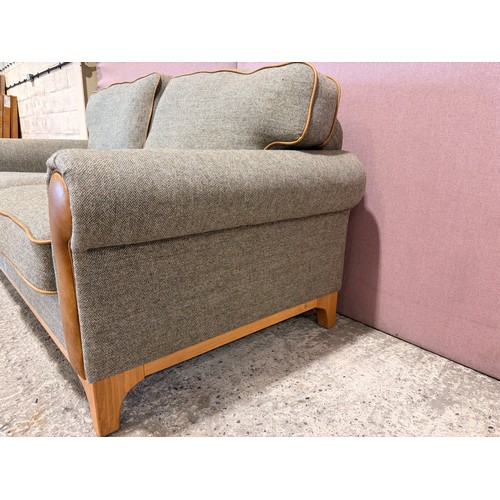 3008 - A Whitwell thistle fabric and tan leather 2 seater sofa (CRES2) (CFD-316-2)
