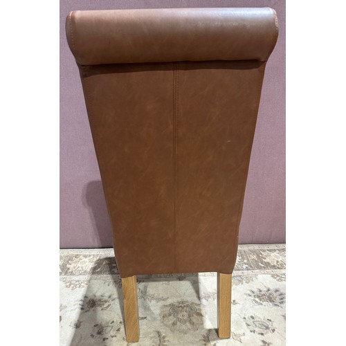 3041 - A tan leather baby rollback dining chair (QBABYROL) (CFL-316-17)