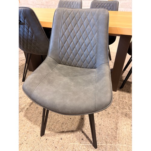 3059 - An oak top table with six Finnick, mulit-colour chairs