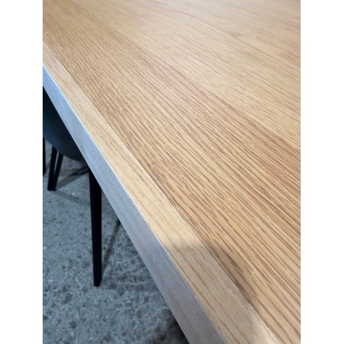 3059 - An oak top table with six Finnick, mulit-colour chairs
