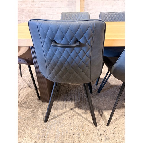 3059 - An oak top table with six Finnick, mulit-colour chairs