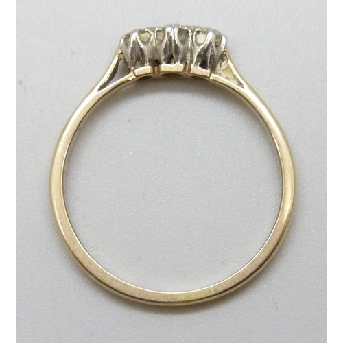 7016 - An 18ct gold and platinum three stone diamond ring, 1.6g, P
