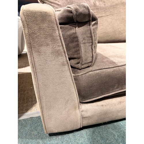 3087 - An umber velvet upholstered 3 seater sofa