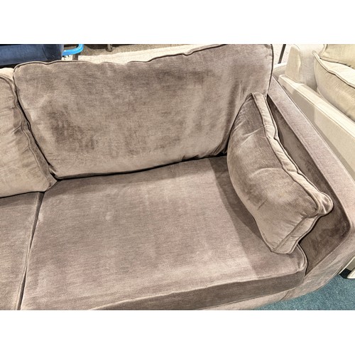3087 - An umber velvet upholstered 3 seater sofa
