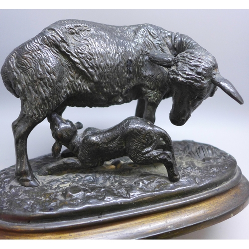 2042 - A pair of model greyhounds on wooden bases, a spelter sheep figure group and another model dog on ba... 