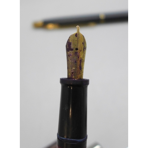 2220 - A Parker 51 fountain pen together with four other pens