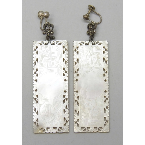 7045 - A pair of drop earrings created from two mother of pearl Chinese gaming tokens engraved with birds t... 