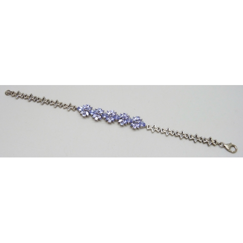 7047 - A silver set gemstone bracelet, possibly iolite, 13g, 20cm
