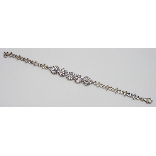 7047 - A silver set gemstone bracelet, possibly iolite, 13g, 20cm