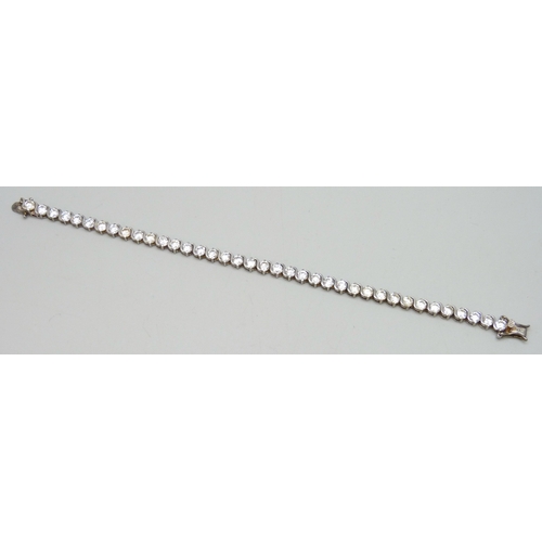 7049 - A silver set cubic zirconia line bracelet, 12g, 18.5cm