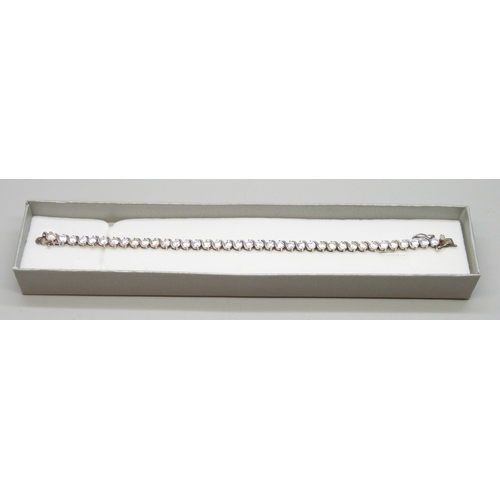 7049 - A silver set cubic zirconia line bracelet, 12g, 18.5cm