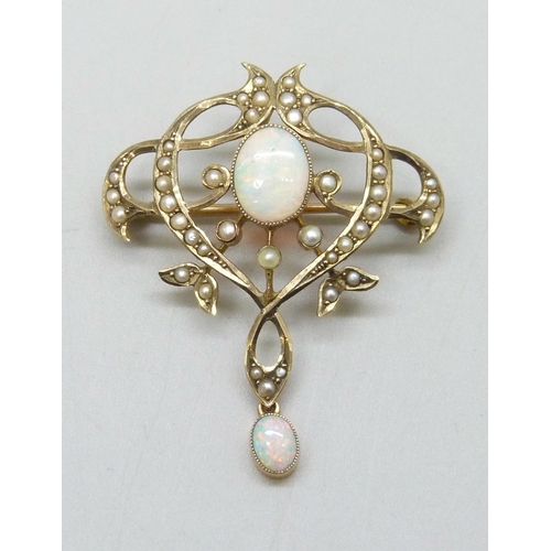 7058 - An early 20th century Art Nouveau 9ct gold, opal and seed pearl brooch, with hook to attach bail to ... 