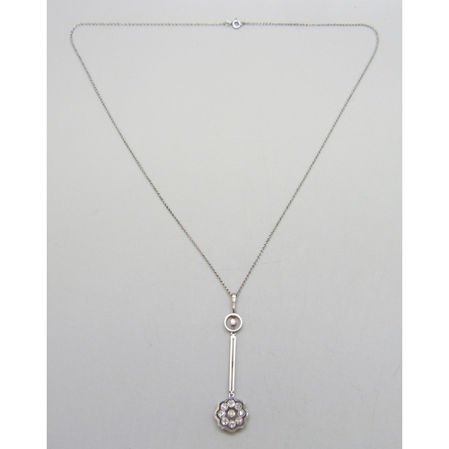 7079 - An Edwardian yellow metal diamond set cluster drop pendant, with white metal front, on a white metal... 