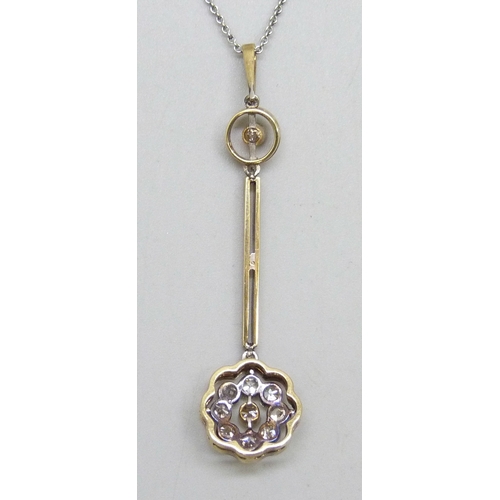 7079 - An Edwardian yellow metal diamond set cluster drop pendant, with white metal front, on a white metal... 