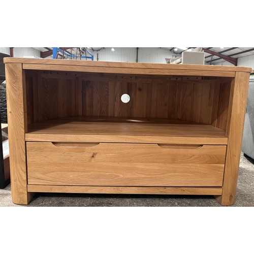 3027 - An Oak Furniture Copenhagen natural solid oak corner TV unit RRP £429 (Cracked foot)