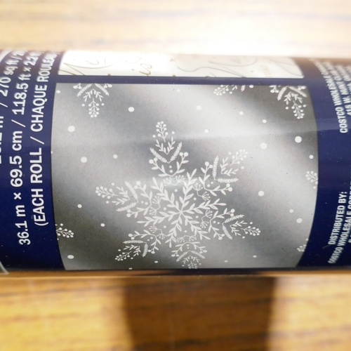 6051 - A power grip broom, a roll of Kirkland Signature Christmas  foil wrapping paper and a Feit shop ligh... 