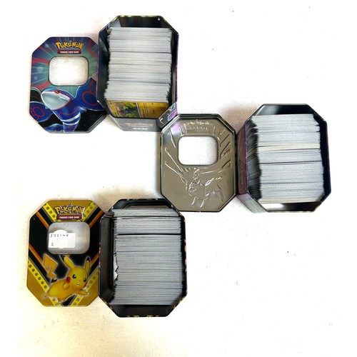 5006B - 3 Pokémon tins containing approximately 1100 Pokémon cards from various sets including Ascended Hero... 