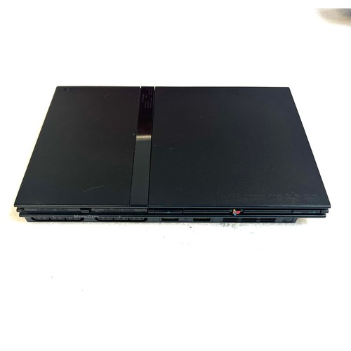 5024A - A PlayStation 2 Slim games console with a Sony Dualshock 2 controller, power supply, AV cables and f... 