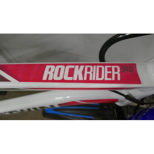 5059 - A B-Twin Rockrider 340 boy's mountain bike front suspension with helmet