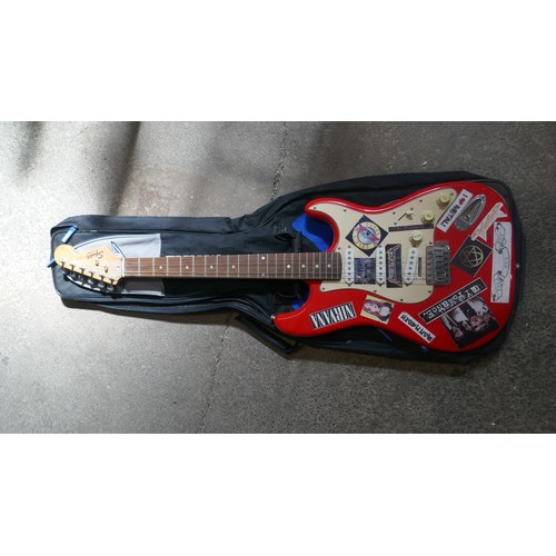 5020 - A quantity of musical items including a Fender Squire electric guitar with case, a Jose Ferrer El Pr... 