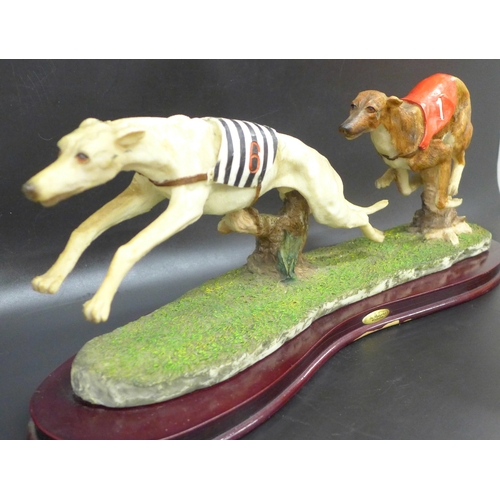 2038 - A Juliana Collection greyhound racing figure in resin on a wooden base, base 48cm