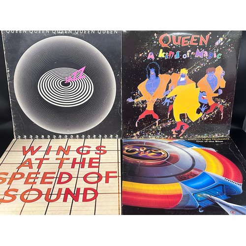 2245 - A collection of records including Queen, Diana Ross, Elvis Presley, etc.