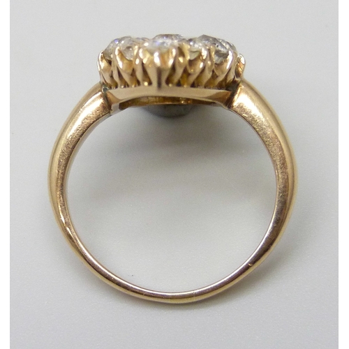 7054A - An 18ct gold old cut diamond cluster ring, 2.5 x 1.2cm, 5g, K