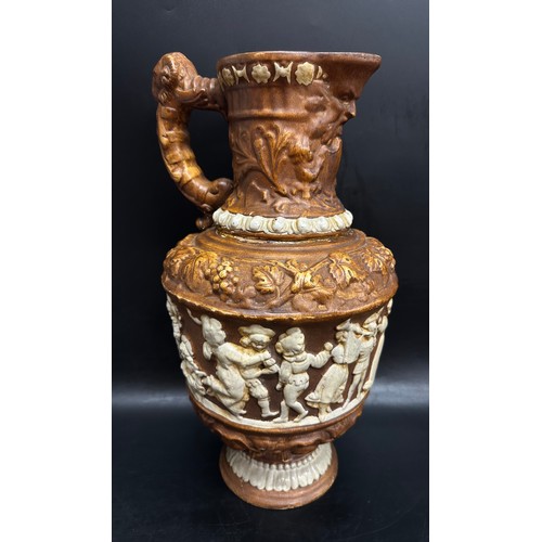 2243 - A large German Black Forest harvest pottery wine jug, c1900, a/f