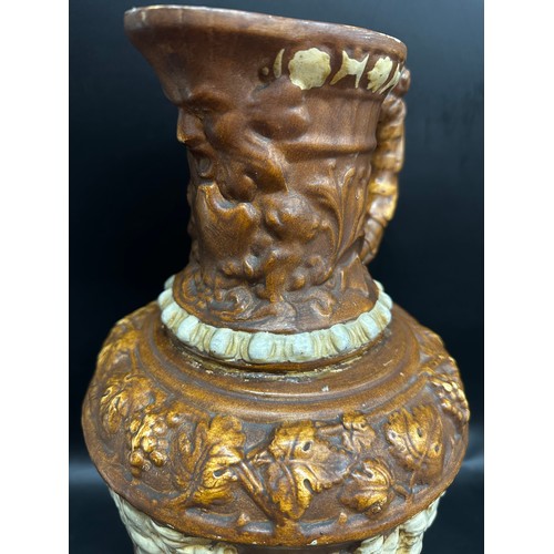 2243 - A large German Black Forest harvest pottery wine jug, c1900, a/f