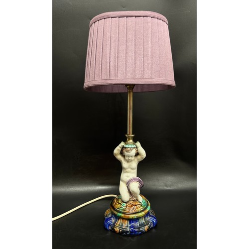 2245 - A ceramic figural putto lamp, Majolica style, with shade