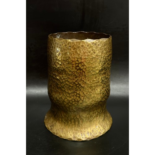 2251 - A hammered brass vase, mark to base DHoH in clover leaf, 16.5cm h