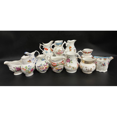 2262 - A collection of twelve Royal Worcester porcelain miniature jugs, various patterns