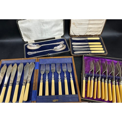 2269 - Four boxed sets of cutlery, faux ivory handles