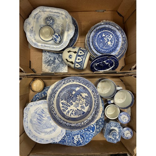 2281 - An assorted collection of blue and white china to include Willow pattern plates and bowls, tile with... 