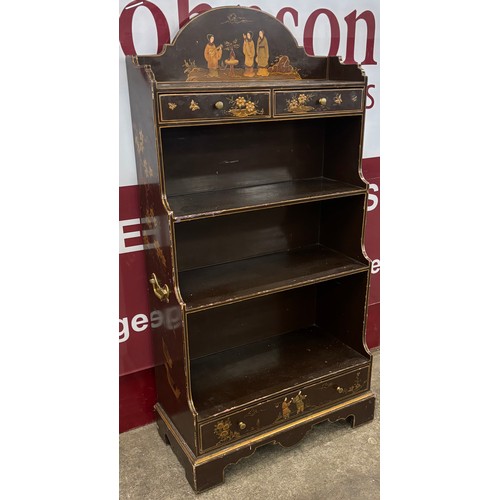 120 - A Regency style brown Japanned waterfall front open bookcase