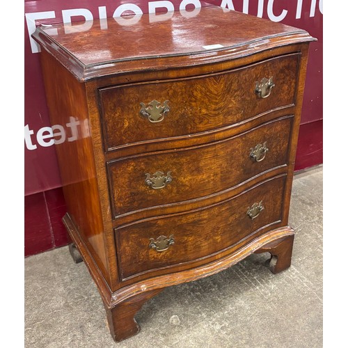 116 - A small George III style walnut serpentine chest of drawers